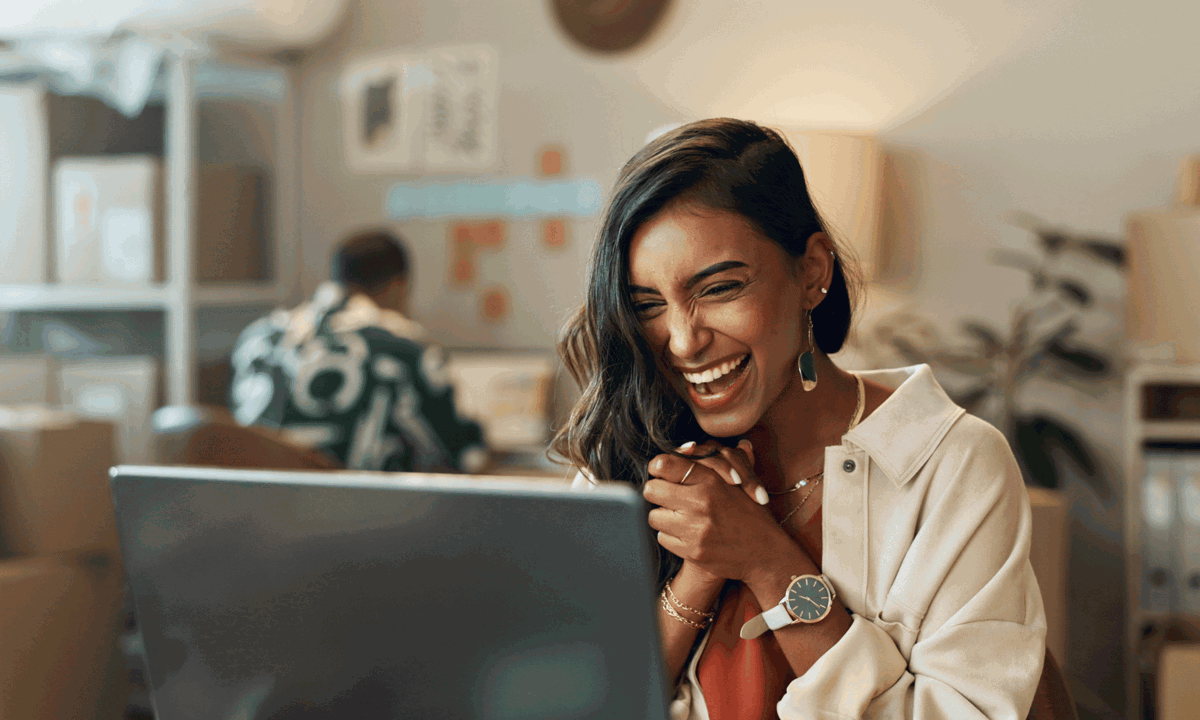 Lady smiling at laptop