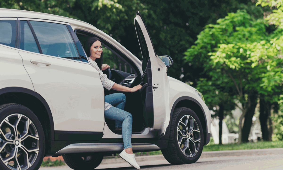 Woman stepping out of car.