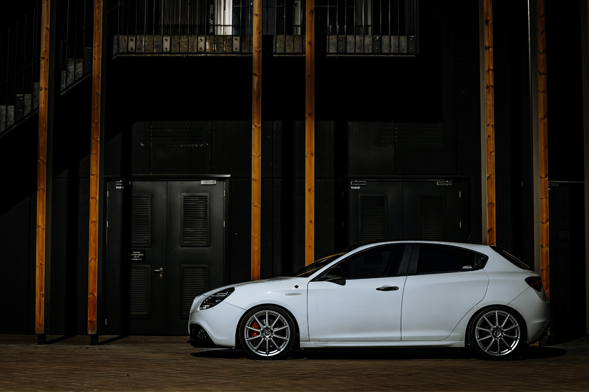 Side profile image of a white alfa romeo