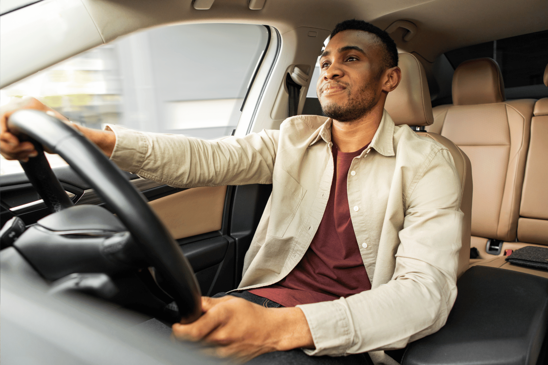 Man holding steering wheel